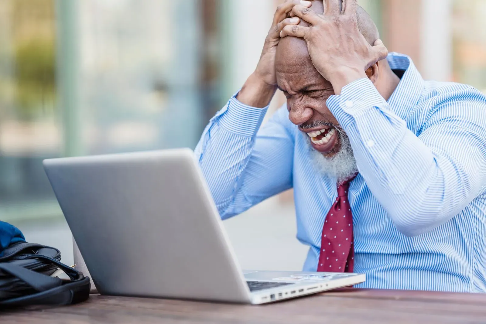 Frustrated B2B marketer in front of a website that does not generate leads