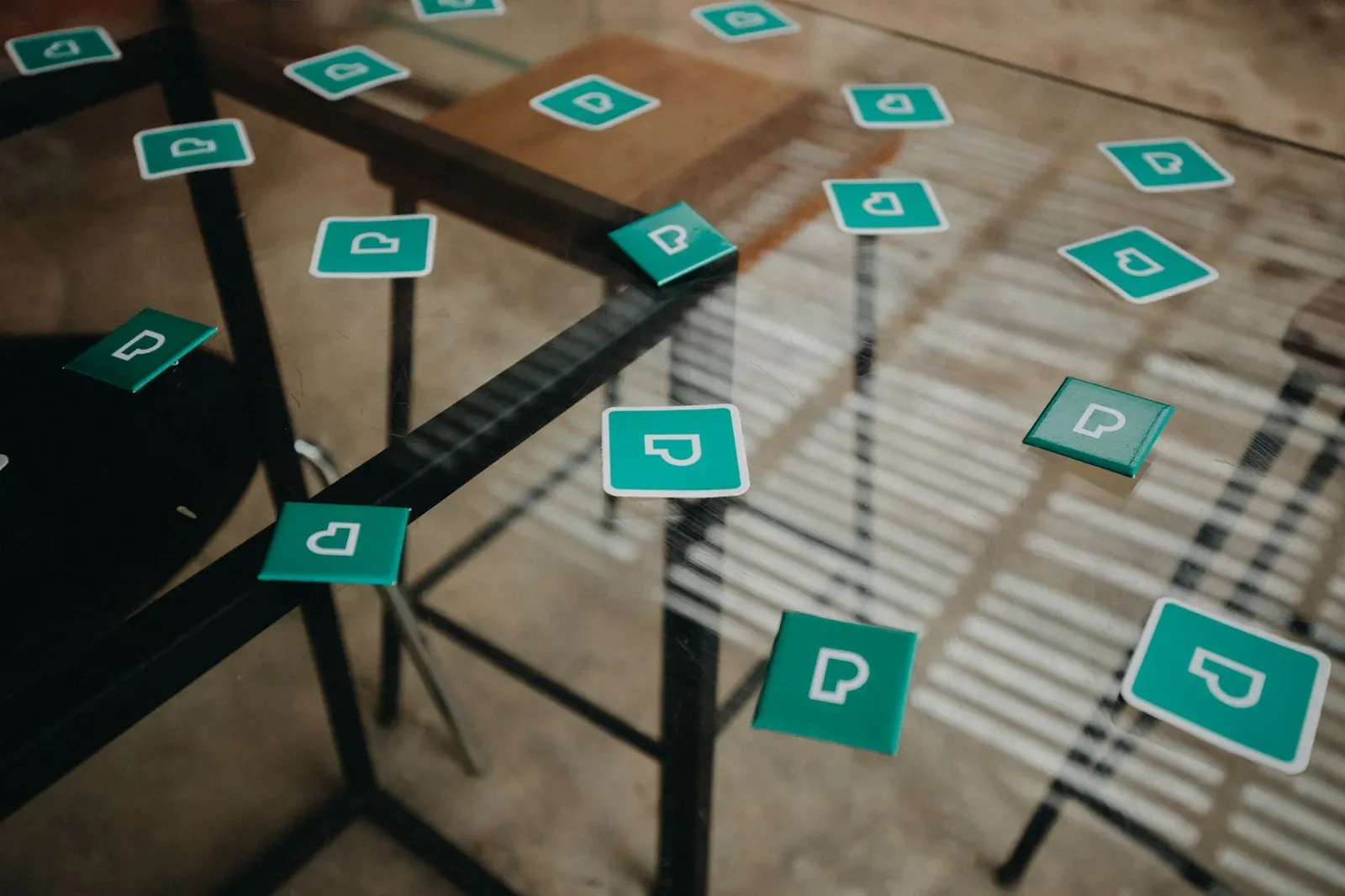 Scattered brand marketing materials showing inconsistent identity