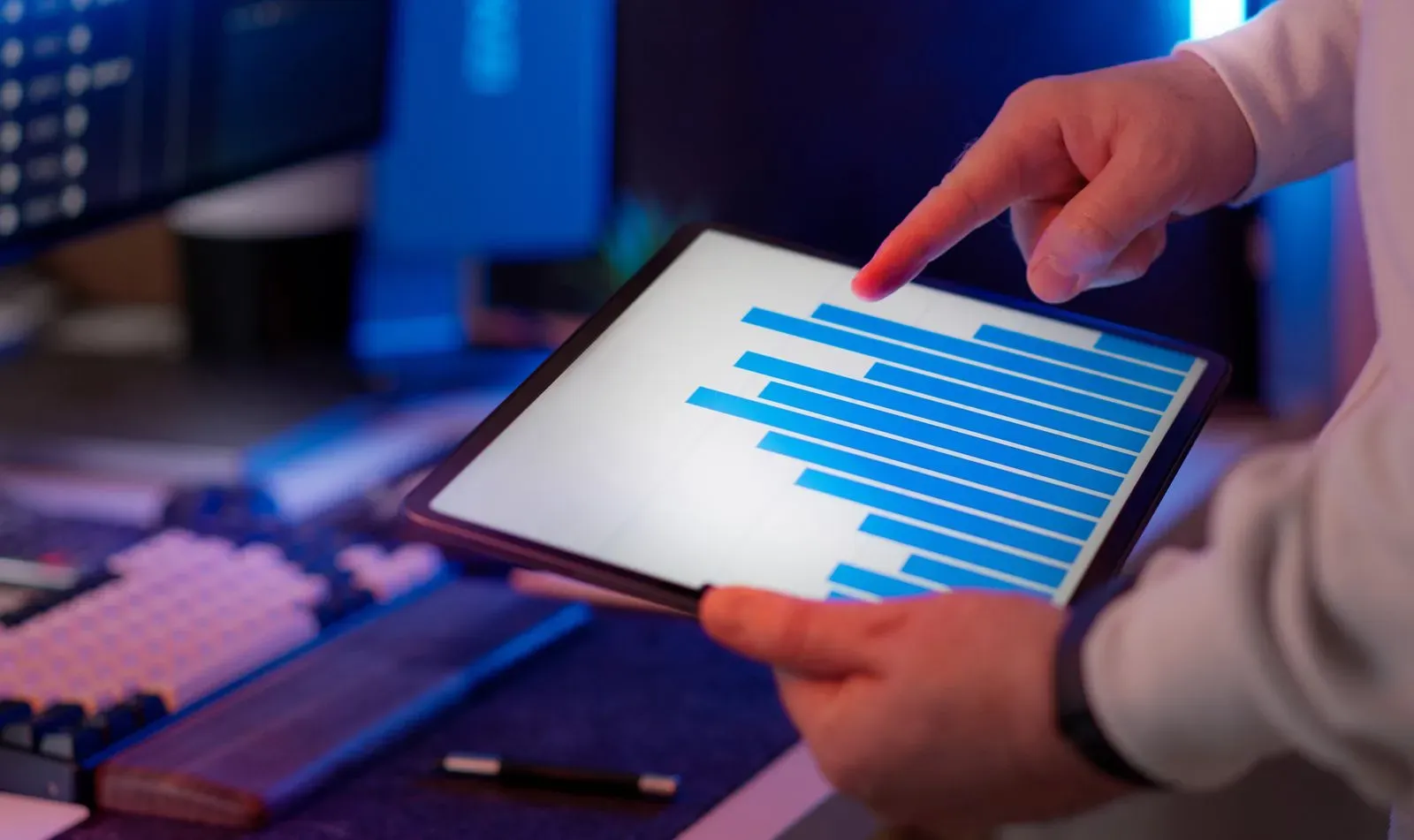 Marketer analyzing attribution data on a tablet
