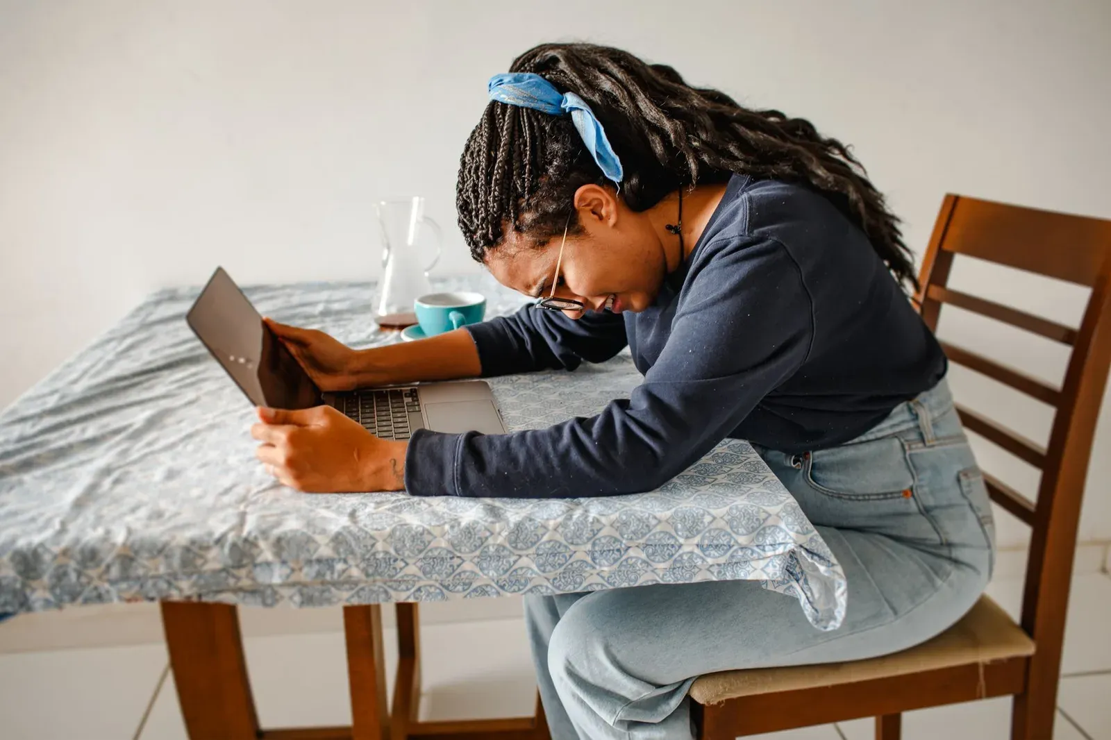 Frustrated person using laptop due to poor UX design services